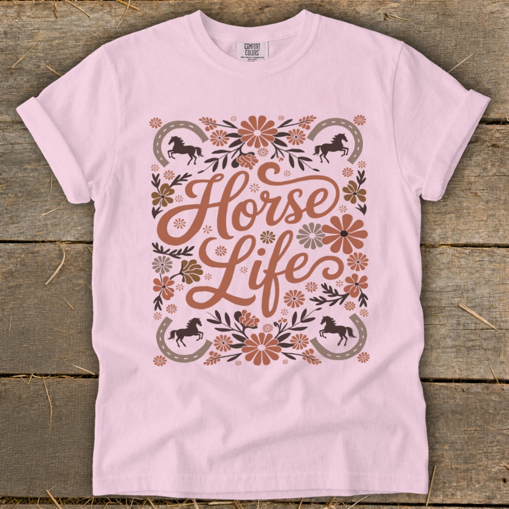 Light pink t-shirt with "Horse Life" text, horses, horseshoes, and floral accents.