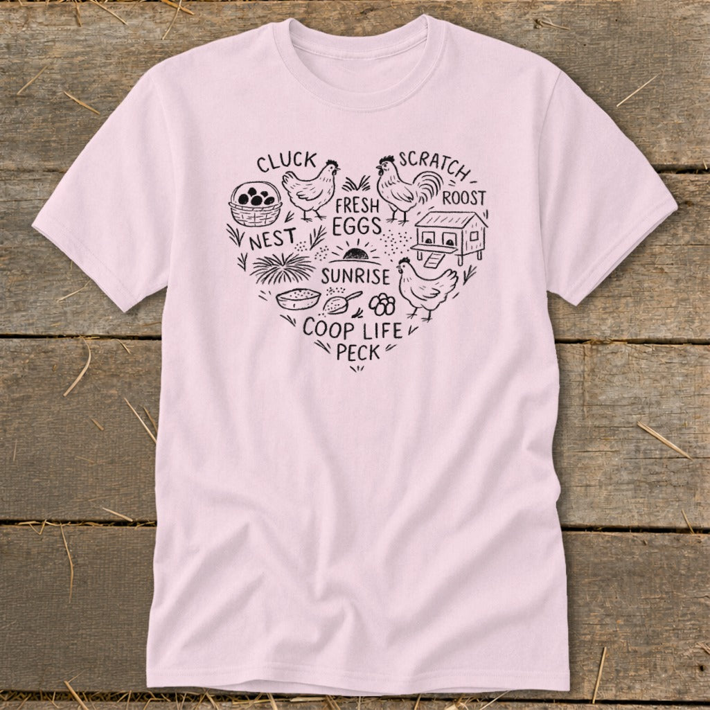 Light pink t-shirt with heart design featuring chickens, coop, eggs, nest, and farm life text.