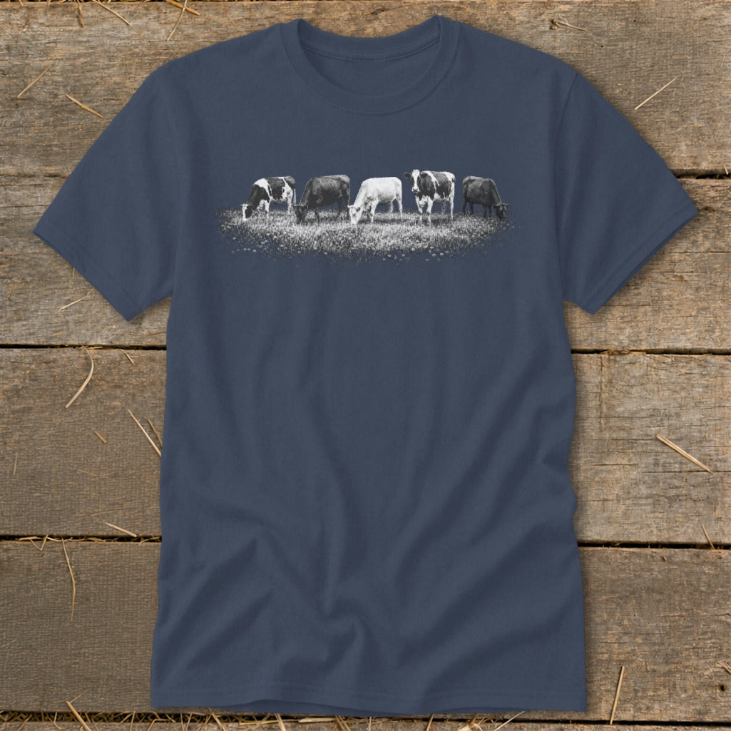 Dark blue t-shirt with graphic of five cows grazing in a field.