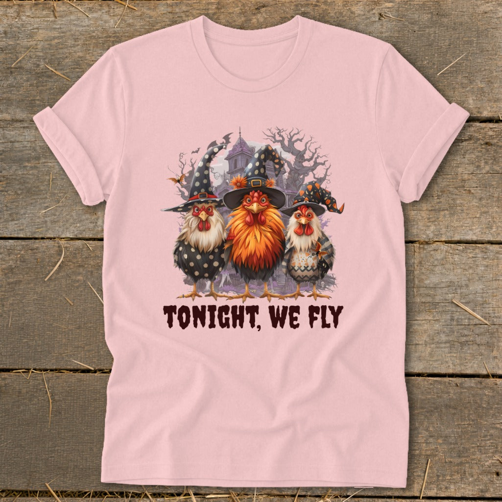 Three chickens in witch hats with text "TONIGHT, WE FLY" on pink t-shirt.