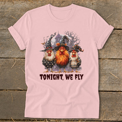 Three chickens in witch hats with text "TONIGHT, WE FLY" on pink t-shirt.