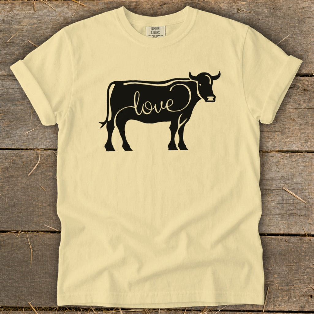 Light yellow t-shirt with a black cow outline filled with the word "love".