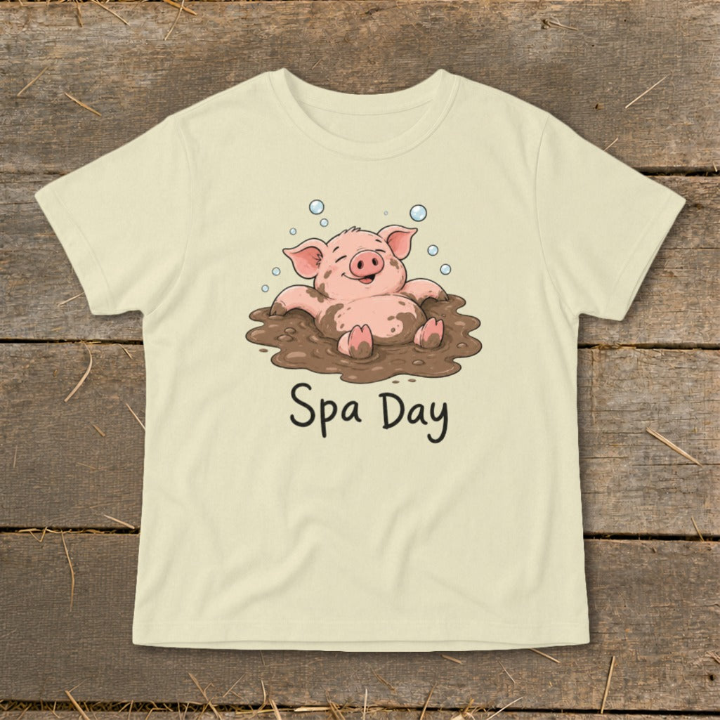 Cream t-shirt with a cartoon pig relaxing in mud with bubbles and text "Spa Day."