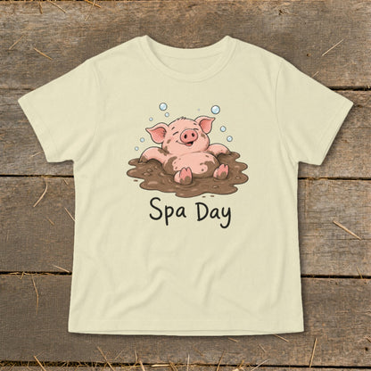 Cream t-shirt with a cartoon pig relaxing in mud with bubbles and text "Spa Day."