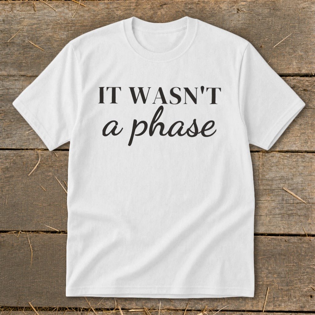 White t-shirt with black text "IT WASN'T a phase".