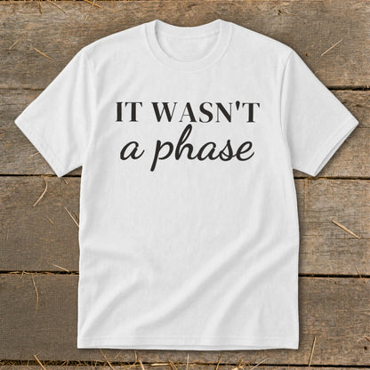 White t-shirt with black text "IT WASN'T a phase".
