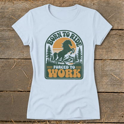 T-shirt with graphic of horse, trees, mountains, and text "BORN TO RIDE FORCED TO WORK".