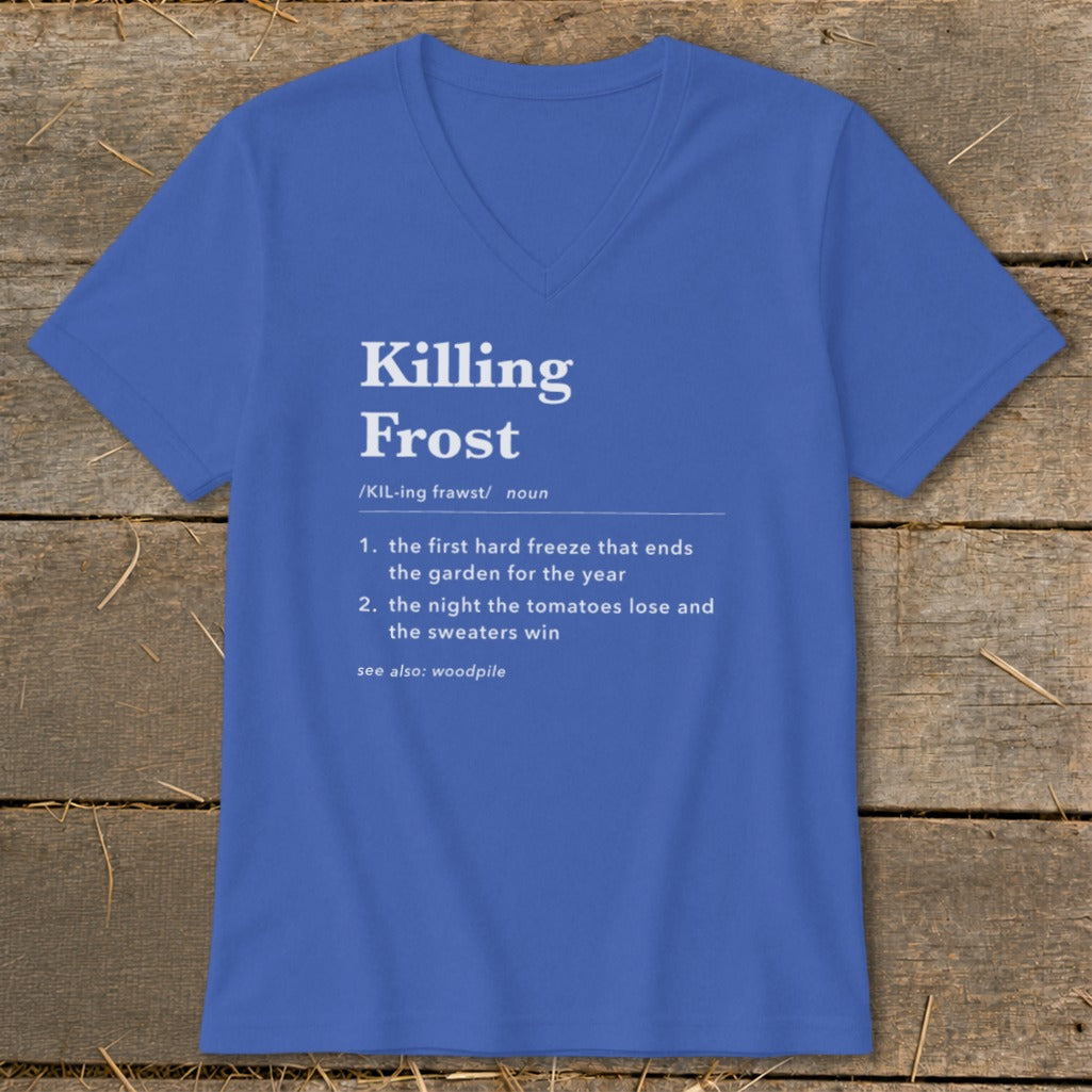 Blue V-neck t-shirt featuring dictionary-style text defining killing frost, laid flat on rustic wood.