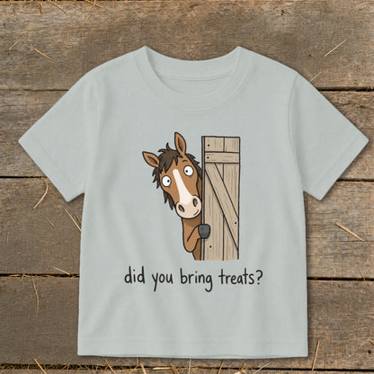 Light blue t-shirt with cartoon horse peeking around a wooden gate asking "did you bring treats?".