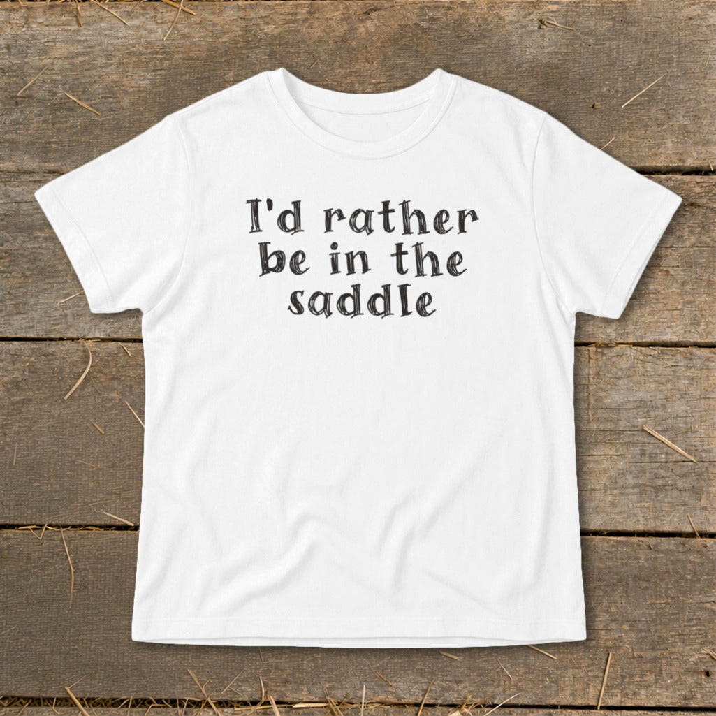 White t-shirt with black text that reads "I'd rather be in the saddle".