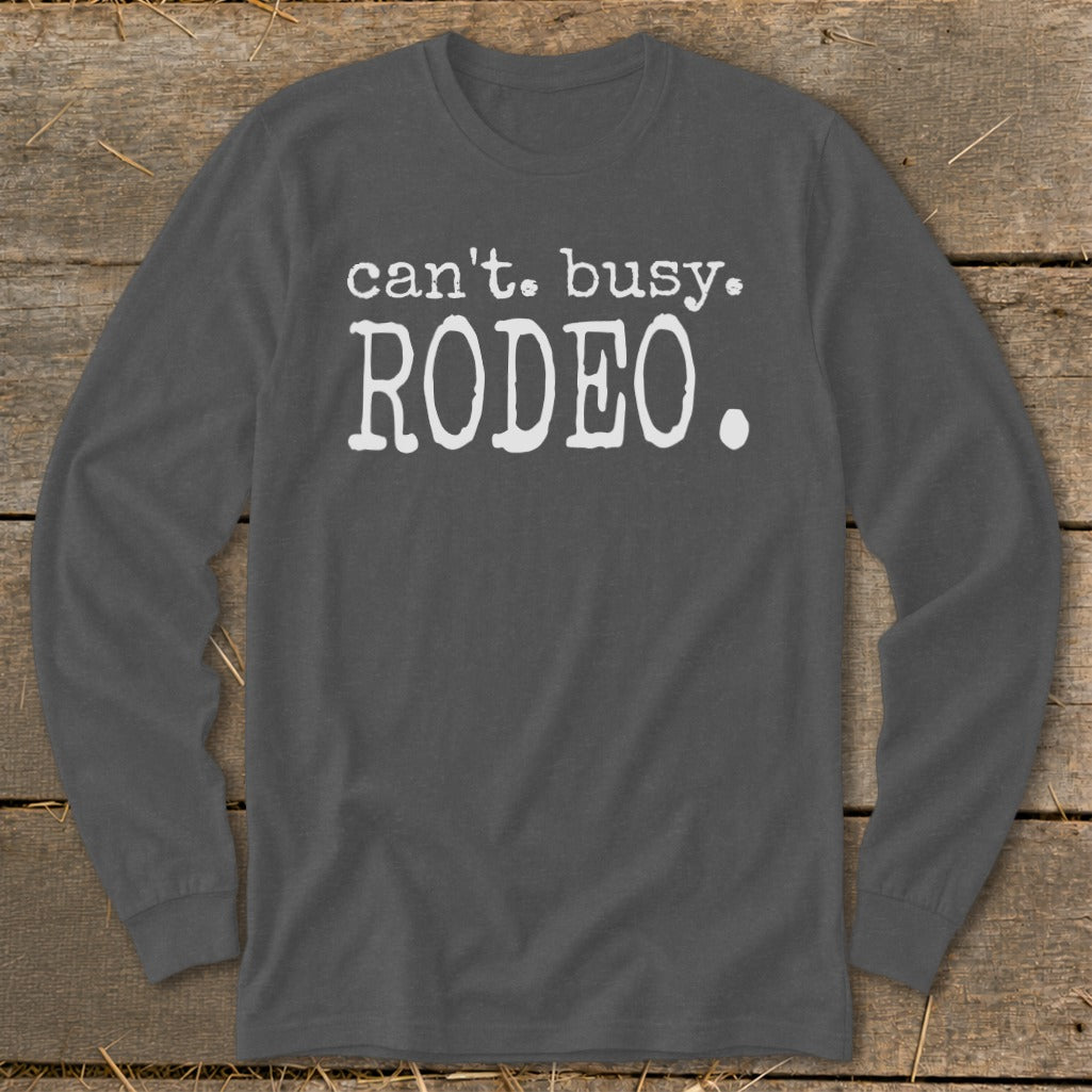 Dark grey long sleeve shirt with white text that reads "can't. busy. RODEO."