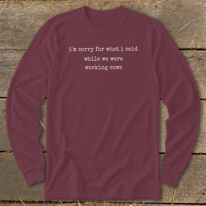 Burgundy long-sleeve shirt with white text: "i'm sorry for what i said while we were working cows."