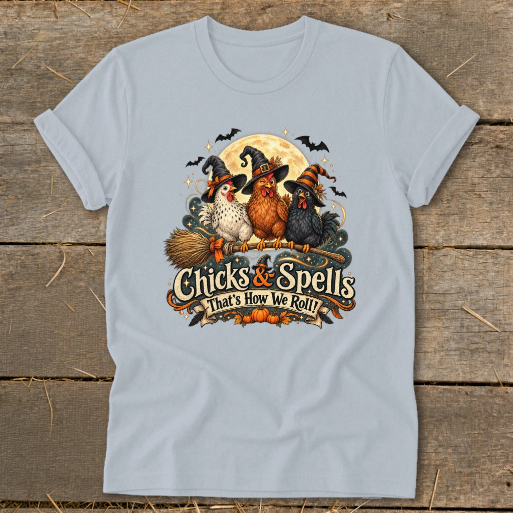 Three chickens in witch hats sit on a broomstick with "Chicks & Spells" text.