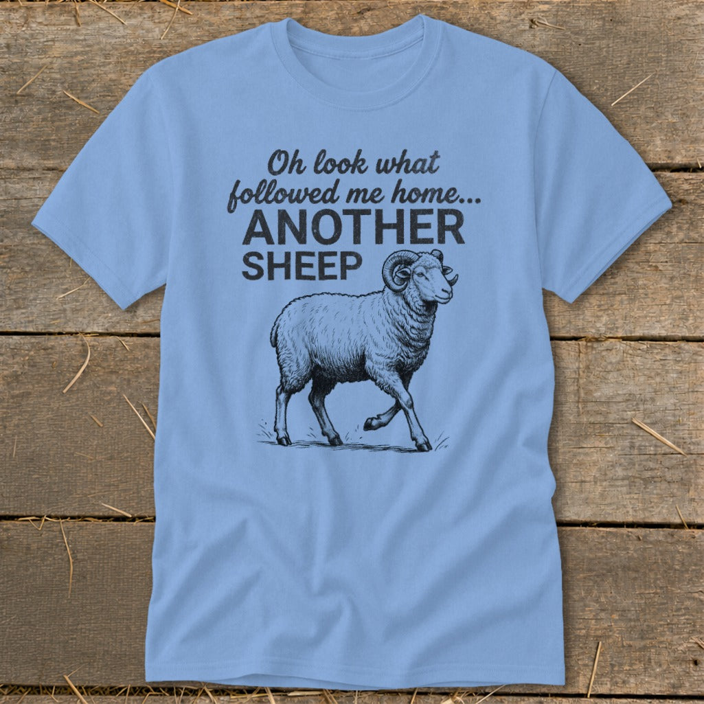 Light blue t-shirt with black text and sheep graphic.