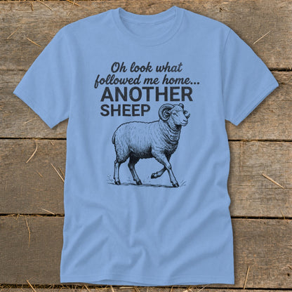 Light blue t-shirt with black text and sheep graphic.