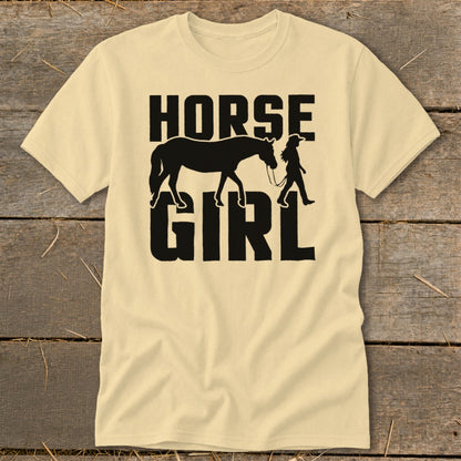 Light yellow t-shirt with black text and silhouette reading "HORSE GIRL" with horse and rider.