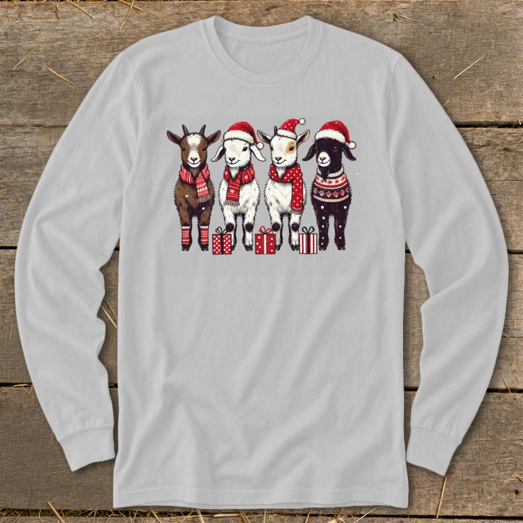 Four cartoon goats wearing Santa hats, scarves, and festive sweaters stand with gifts.