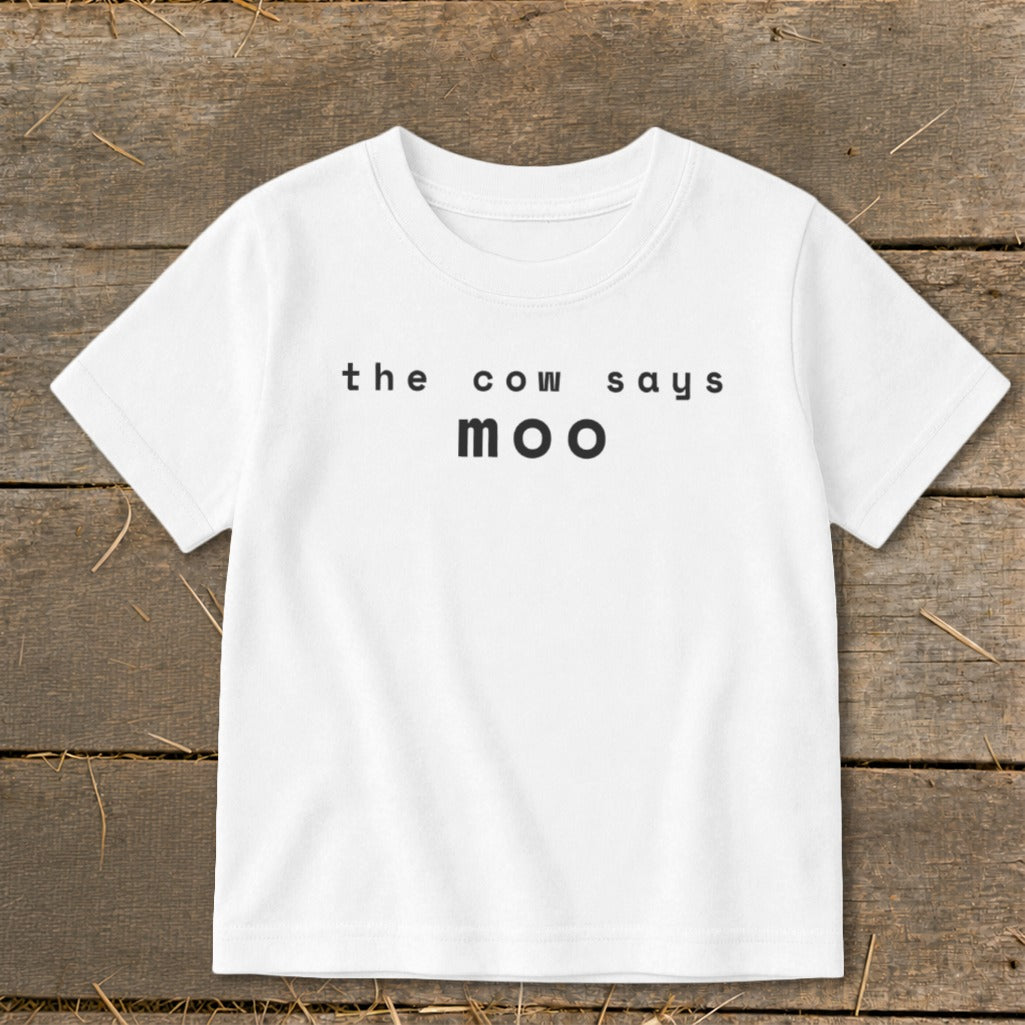 White t-shirt with black text that reads "the cow says moo".
