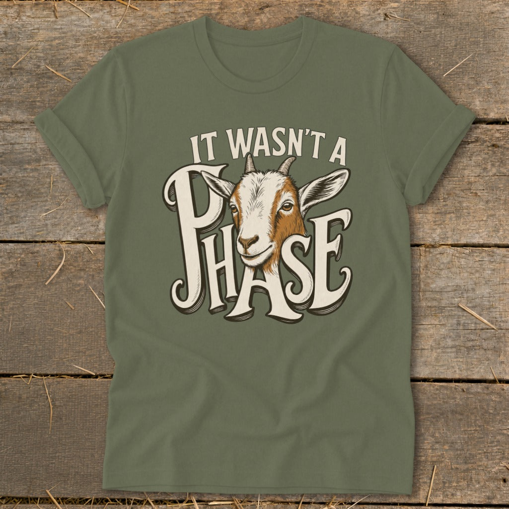 Green t-shirt with a goat and "It Wasn't A Phase" text.