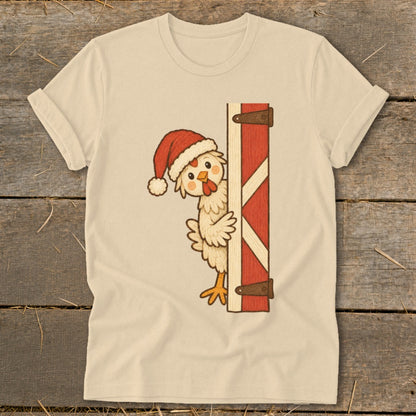 Chicken wearing Santa hat peeking from behind red barn door.