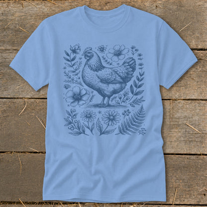 Light blue t-shirt with a vintage chicken and floral illustration.