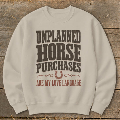 Light beige sweatshirt with "Unplanned Horse Purchases Are My Love Language" text.