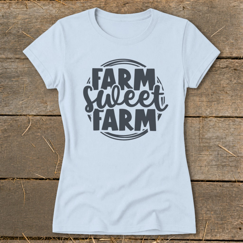 Light blue t-shirt with dark gray text reading "Farm Sweet Farm" in a circular design.