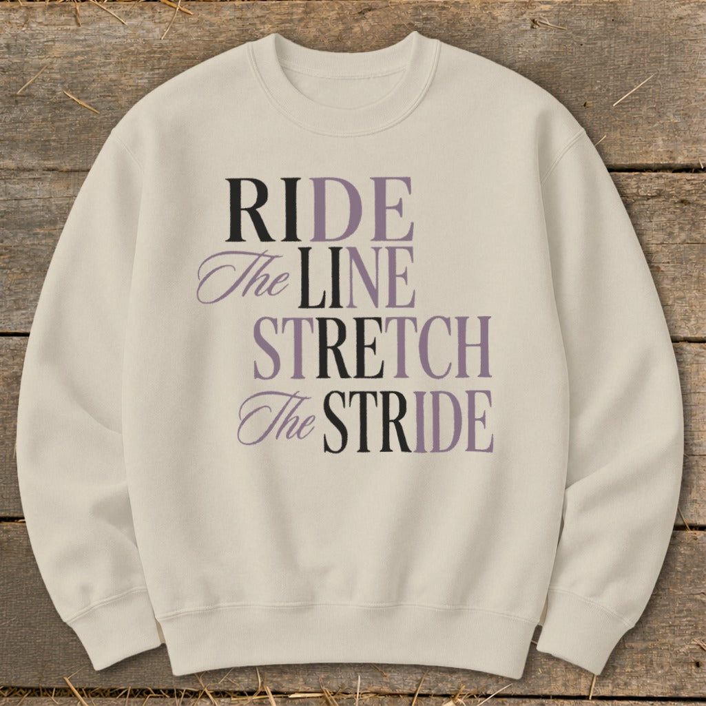 Cream sweatshirt with "RIDE The LINE STRETCH The STRIDE" text in purple and black.