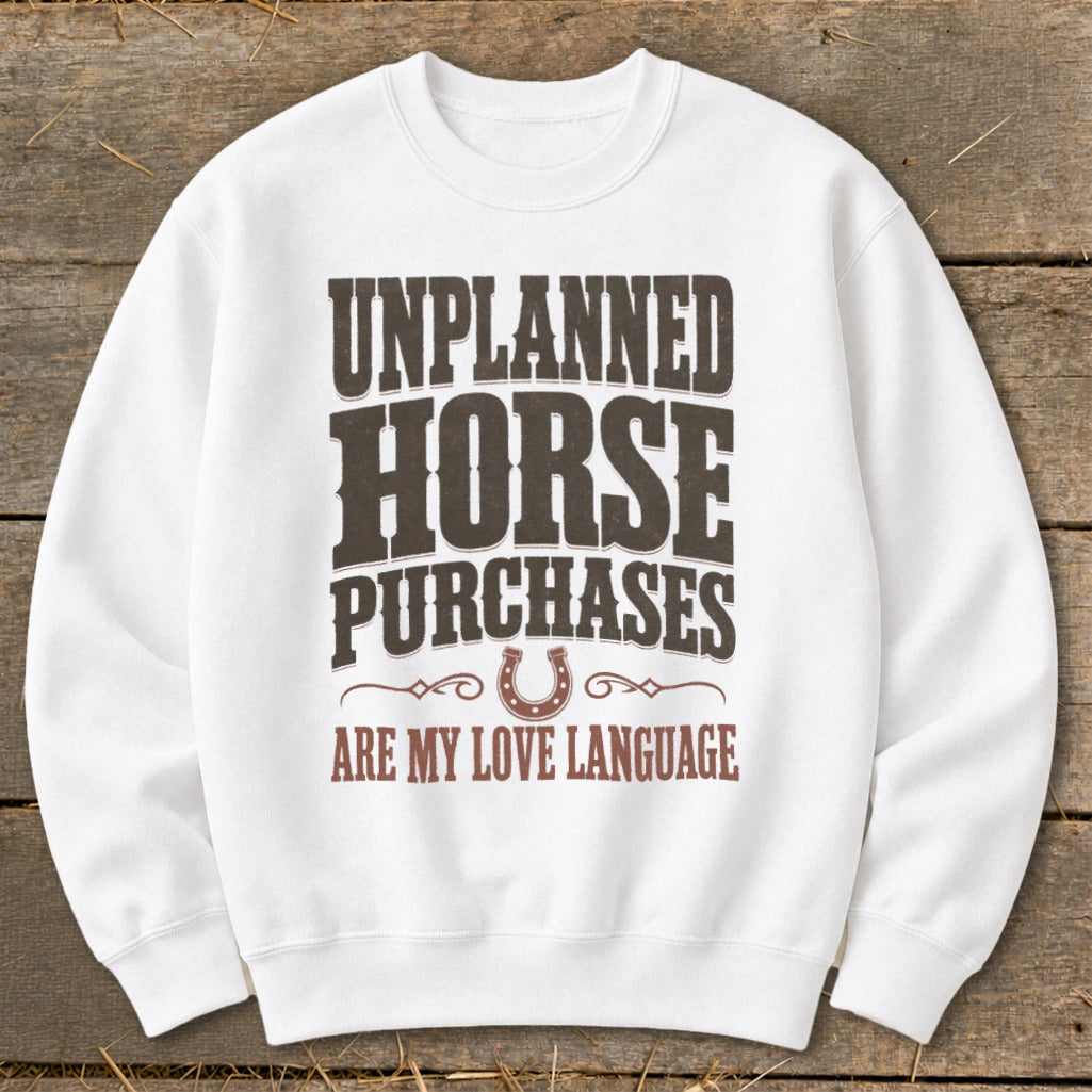 White sweatshirt with "Unplanned Horse Purchases Are My Love Language" text.