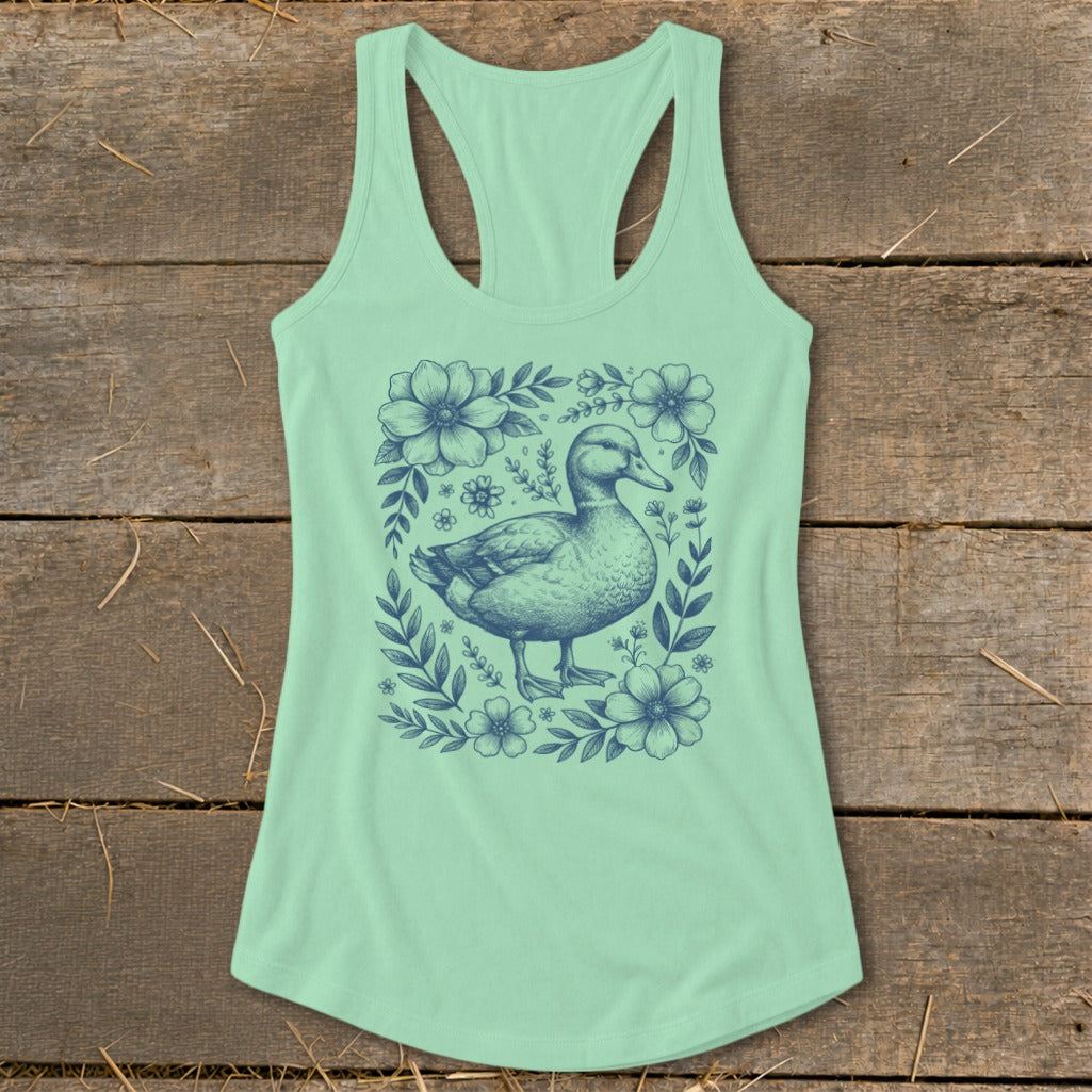 Mint green tank top with a navy blue duck and floral illustration.