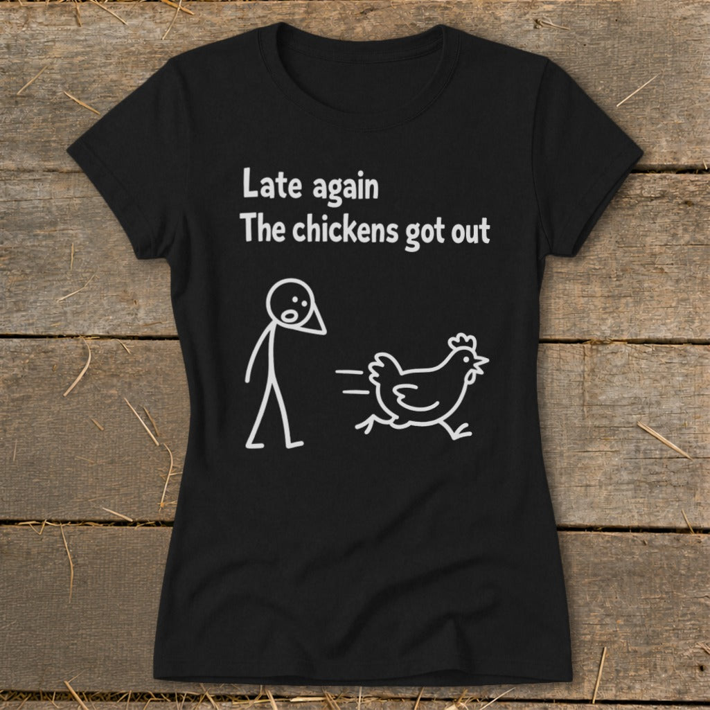 Black t-shirt with white text and cartoon of stick figure chasing a chicken.