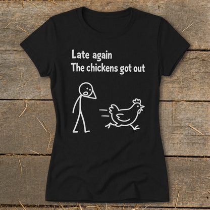 Black t-shirt with white text and cartoon of stick figure chasing a chicken.