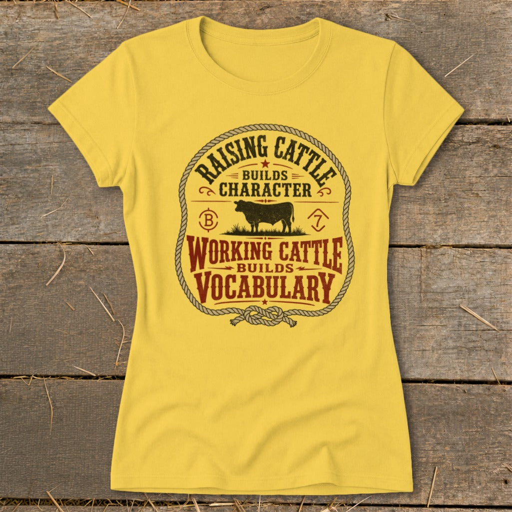 Yellow t-shirt with "Raising Cattle Builds Character" and "Working Cattle Builds Vocabulary" text and bull graphic.