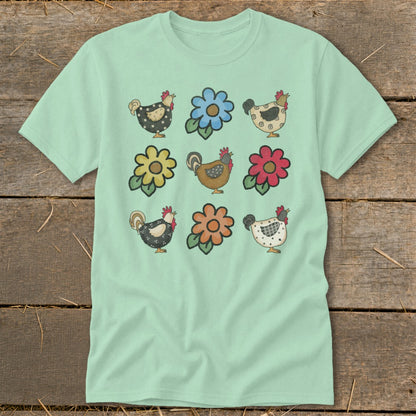 Light mint green t-shirt with a nine-panel print of chickens and flowers.