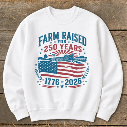 White sweatshirt with patriotic farm design and "Farm Raised 250 Years" text.