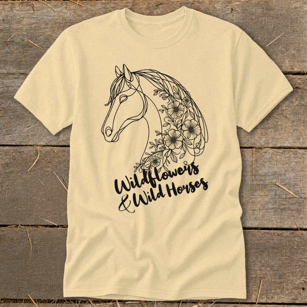 Cream t-shirt with a black line drawing of a horse's head adorned with flowers and text.