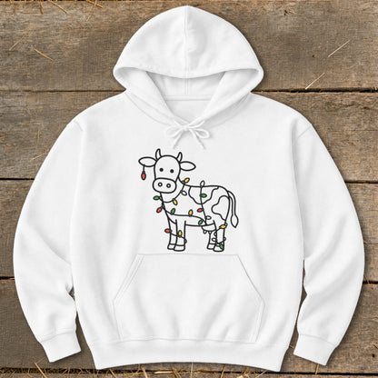 White hoodie with a black line art cow wrapped in colorful Christmas lights.