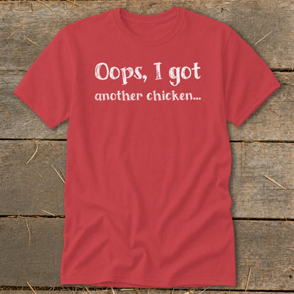 Red t-shirt with white text reading "Oops, I got another chicken..."