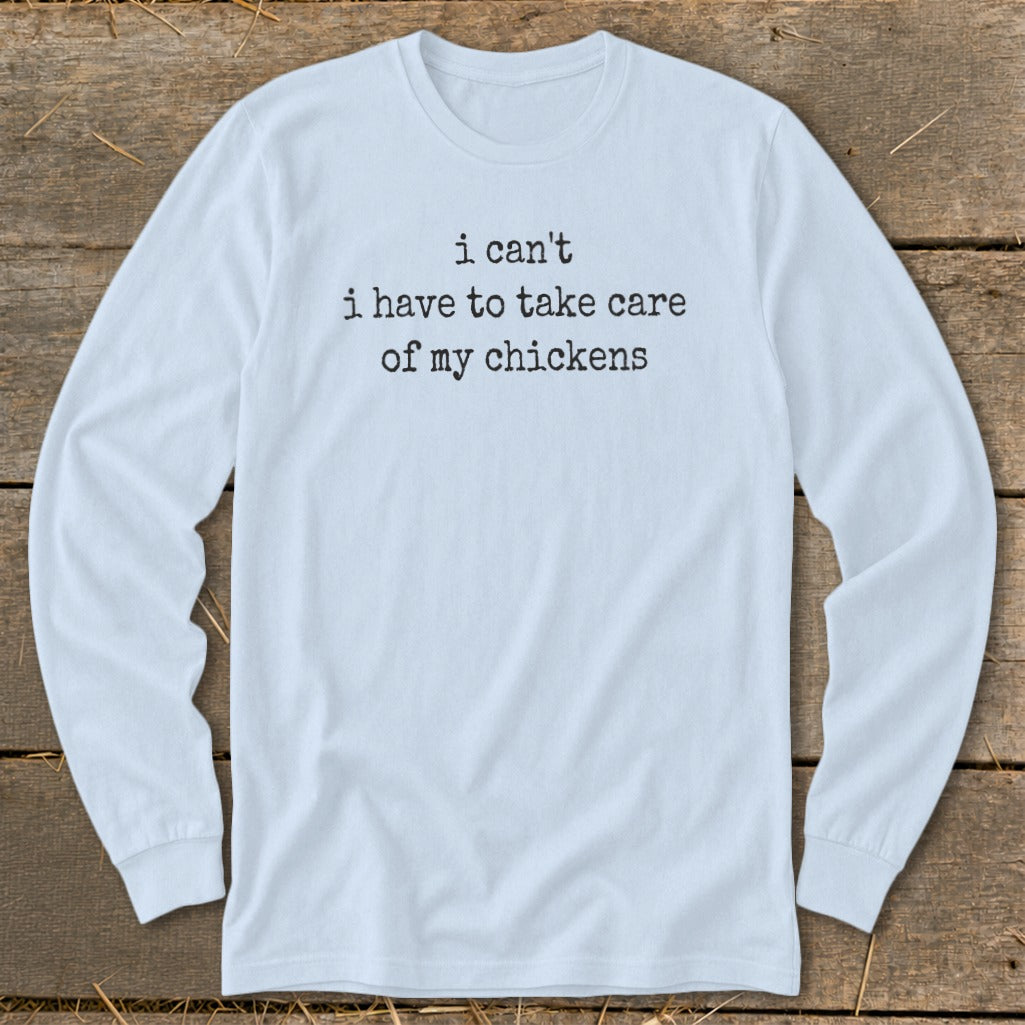 Light blue long-sleeve shirt with "i can't i have to take care of my chickens" text.