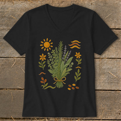 Black v-neck t-shirt with botanical illustration featuring herbs, flowers, and sun.