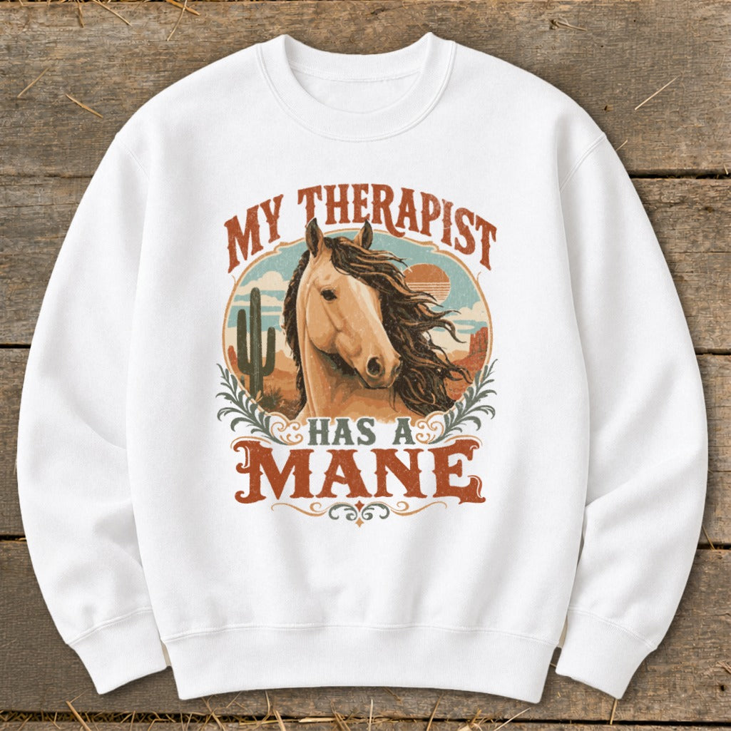White sweatshirt with a graphic featuring a horse head and the text "My Therapist Has A Mane".