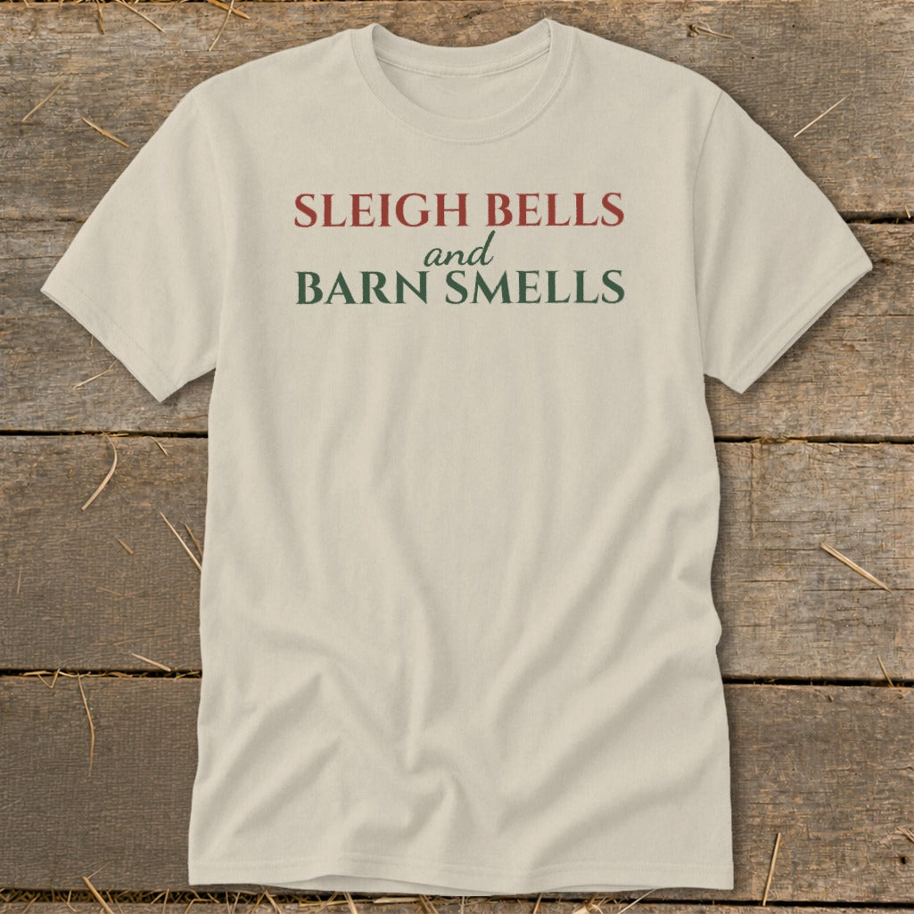 Cream t-shirt with text "Sleigh Bells and Barn Smells" in red and green.