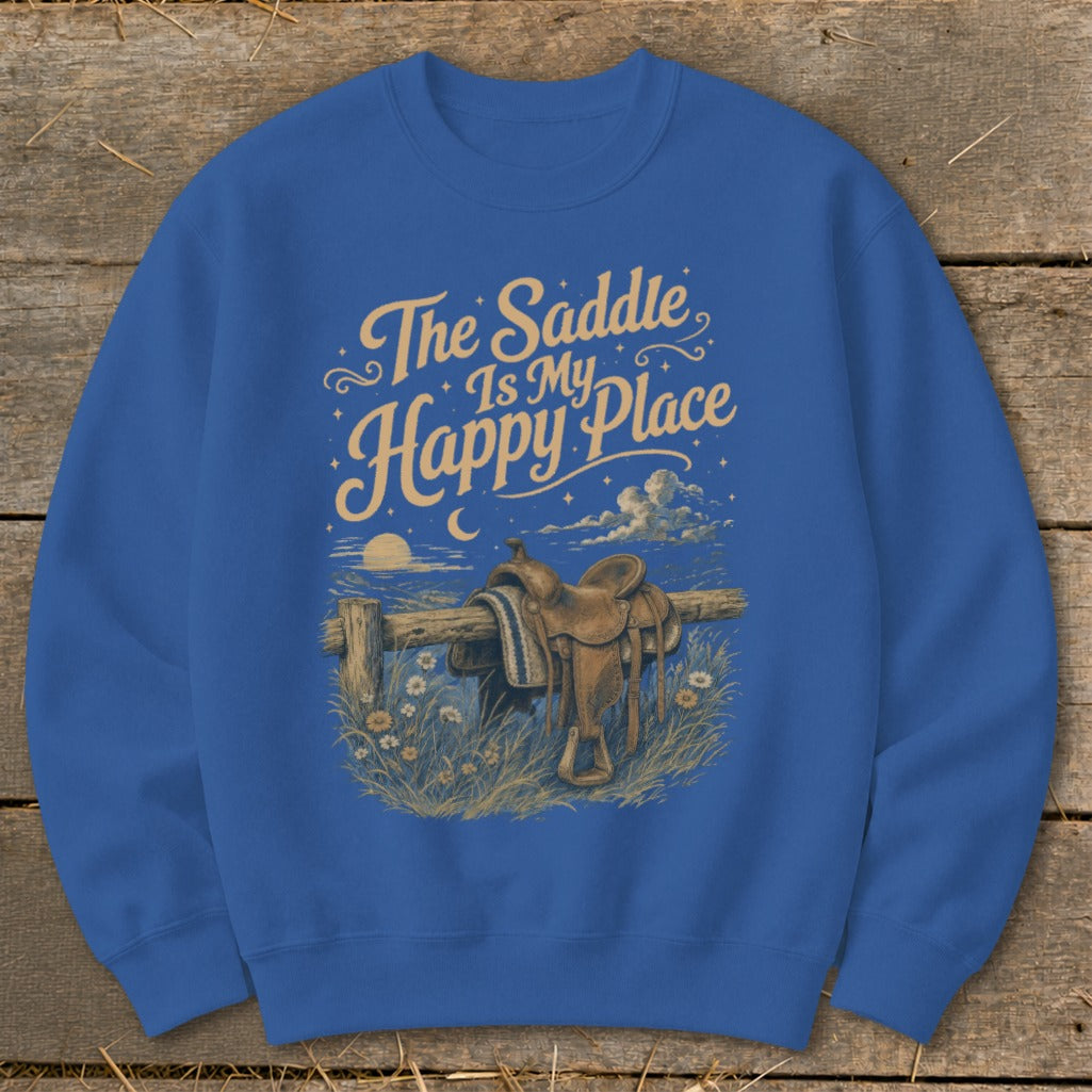 Blue sweatshirt with graphic "The Saddle Is My Happy Place" and western saddle on fence.