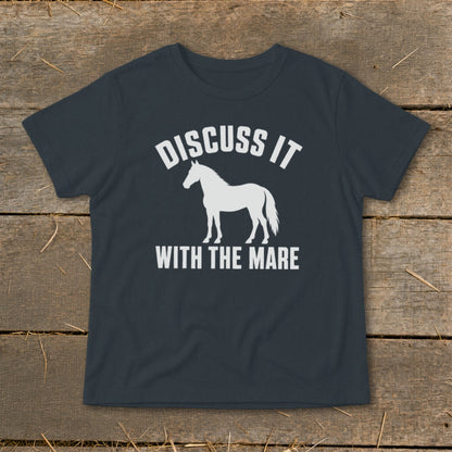 Dark t-shirt with white graphic text "DISCUSS IT" above a horse silhouette and "WITH THE MARE" below.