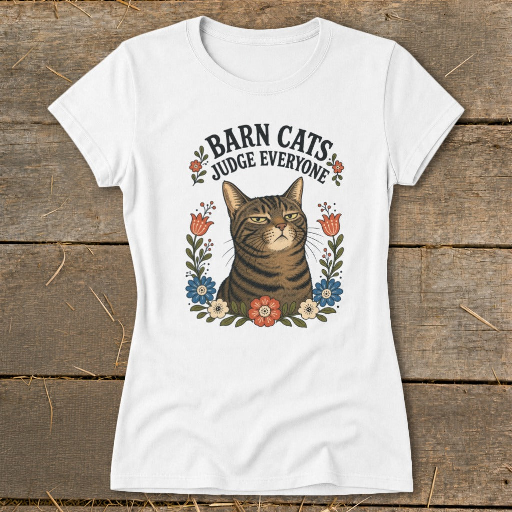 White t-shirt with a brown tabby cat surrounded by flowers and the text "Barn Cats Judge Everyone".