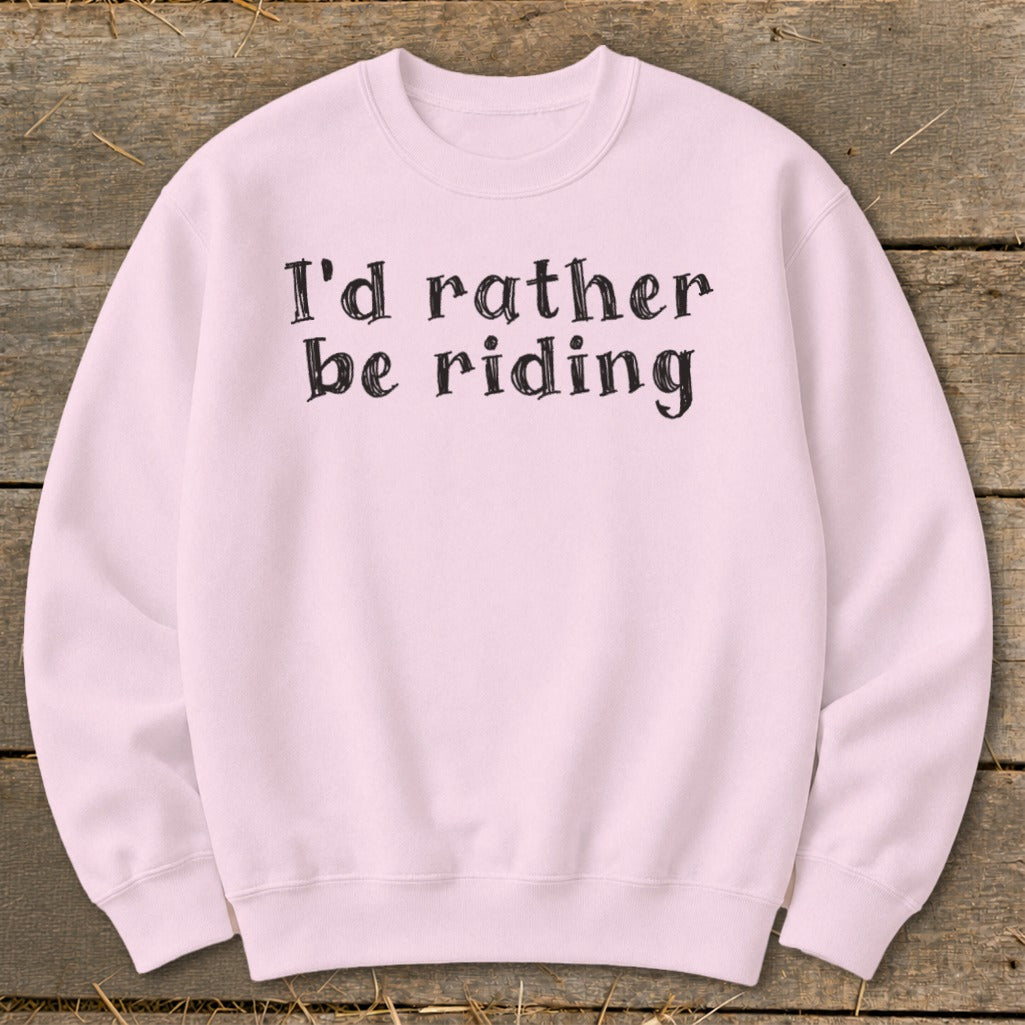 Pink crewneck sweatshirt with black text that reads "I'd rather be riding."