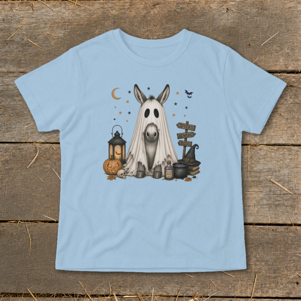 Donkey in a ghost costume with Halloween decorations and signs.