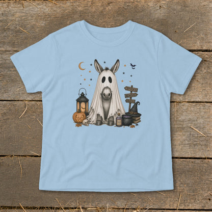 Donkey in a ghost costume with Halloween decorations and signs.