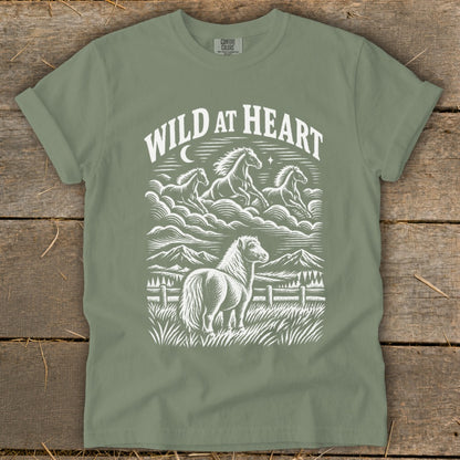 T-shirt with white graphic of horses and mountains, text reads "WILD AT HEART".