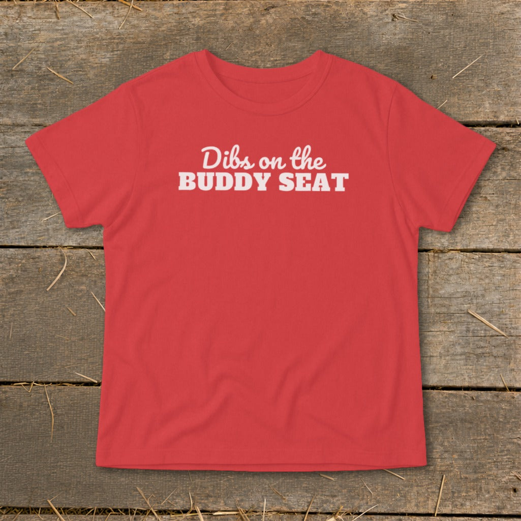 Red t-shirt with white text "Dibs on the BUDDY SEAT".